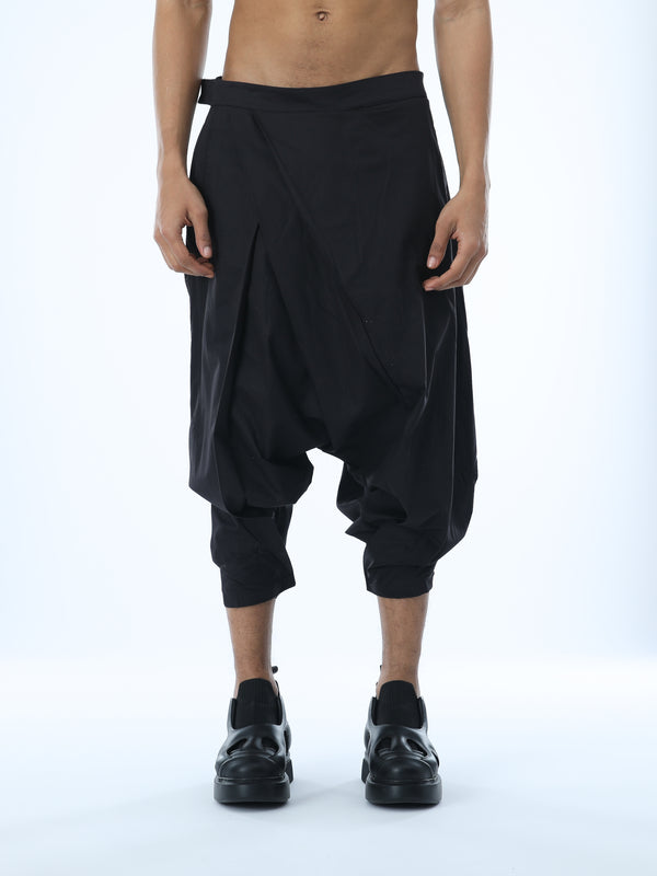 Junus Coban men’s wide pleated drop-crotch capri pants in black front view