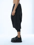 Junus Coban men’s black wide pleated capri pants side view