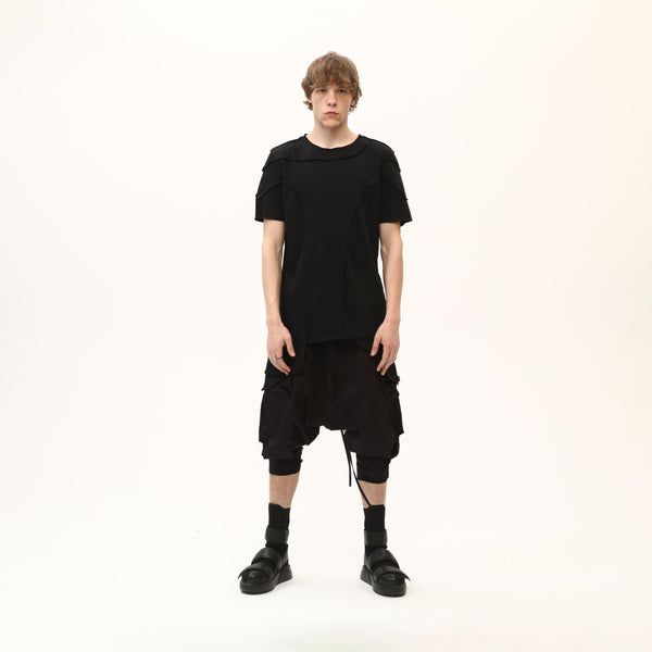 Junus Coban Men’s Multi-Pleated Capri Trousers with Piped Skirted Pockets utility pocketed pleated avant garde capri