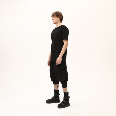 Junus Coban Men’s Multi-Pleated Capri Trousers with Piped Skirted Pockets utility pocketed pleated avant garde capri