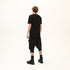 Junus Coban Men’s Multi-Pleated Capri Trousers with Piped Skirted Pockets utility pocketed pleated avant garde capri