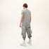 Back angle view of men’s grey asymmetric raw seam T-shirt with layered raw seam detail.