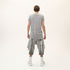 Back view of men’s grey asymmetric raw seam T-shirt with irregular hem and relaxed streetwear fit.