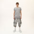 Front view of men’s grey asymmetric raw seam T-shirt with uneven hem and avant-garde streetwear styling.