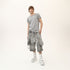 Full styling view of men’s grey asymmetric raw seam T-shirt for avant-garde festival outfits.