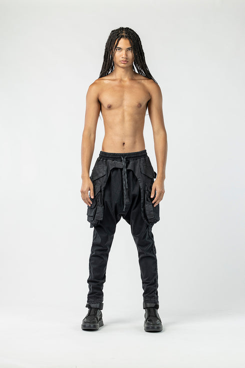 Men's black multi-pocket pants front view.