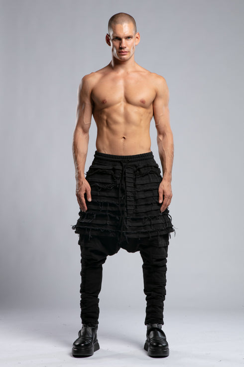 Junus Coban Men's Denim Detail Pants in Acid Black front view with dropped silhouette and layered distressed detailing