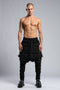 Junus Coban Men's Denim Detail Pants in Acid Black front view with dropped silhouette and layered distressed detailing