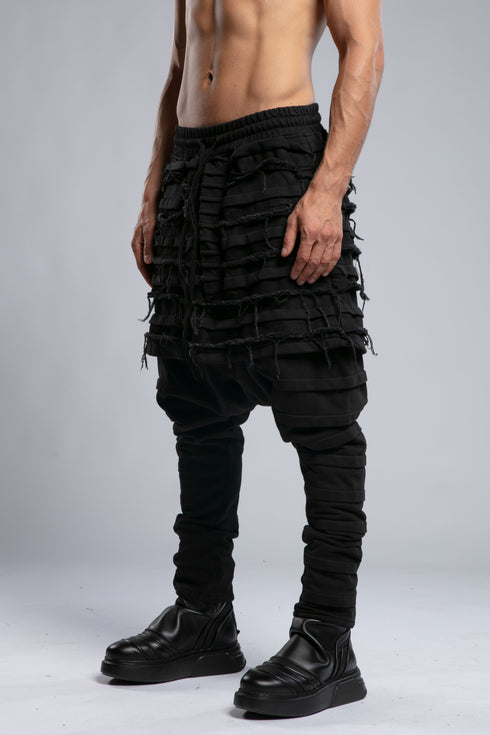 Junus Coban Men's Denim Detail Pants in Acid Black side view with dropped crotch and textured panel construction