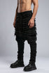 Junus Coban Men's Denim Detail Pants in Acid Black side view with dropped crotch and textured panel construction