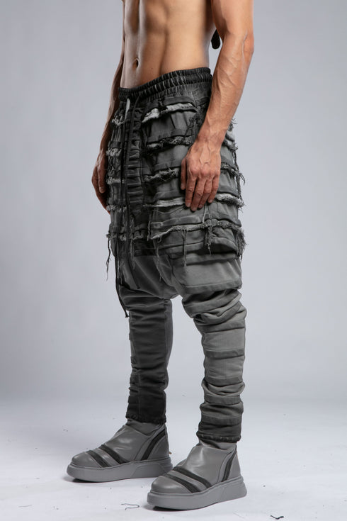 Junus Coban Men's Denim Detail Pants in Acid Grey back view with layered raw-edge detailing