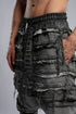 Junus Coban Men's Denim Detail Pants in Acid Grey detail view showing distressed layered panel texture
