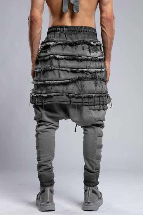 Junus Coban Men's Denim Detail Pants in Acid Grey profile view with sculptural shape and distressed detail