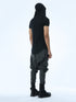 Back angle view of men’s black hooded T-shirt showing pleated hood and back seam detail.