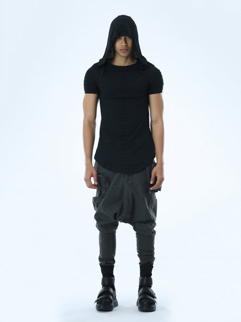 Front view of men’s black hooded multi-pleated T-shirt with short sleeves and bold avant-garde streetwear styling.