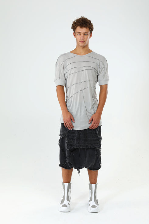 Front view of men’s grey paneled raw seam T-shirt with crew neck, short sleeves and clean avant-garde silhouette.