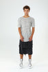 Front view of men’s grey paneled raw seam T-shirt with crew neck, short sleeves and clean avant-garde silhouette.