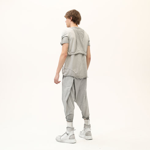 Back angle view of men’s anthracite raw seam T-shirt with layered shoulder and back construction.