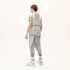 Back angle view of men’s anthracite raw seam T-shirt with layered shoulder and back construction.