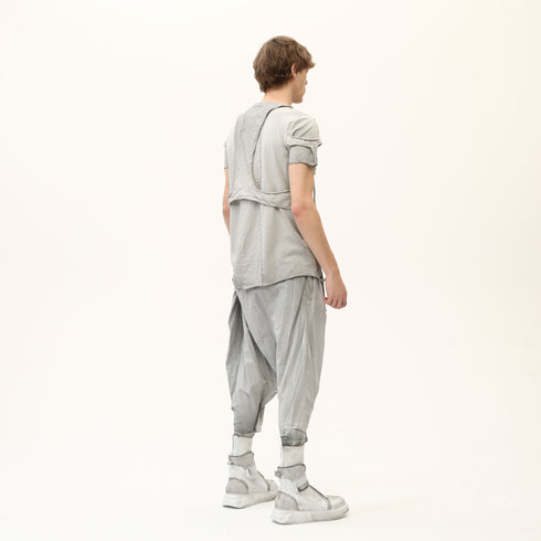 Back side view of men’s anthracite raw seam T-shirt with sculptural shoulder detail and streetwear silhouette.