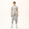 Front full look of men’s anthracite raw seam avant-garde T-shirt styled with drop-crotch pants.