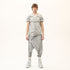 Front full look of men’s anthracite raw seam avant-garde T-shirt styled with drop-crotch pants.