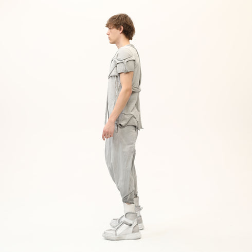 Side profile of men’s anthracite avant-garde T-shirt showing raw seam construction and asymmetric shape.