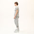 Side profile of men’s anthracite avant-garde T-shirt showing raw seam construction and asymmetric shape.