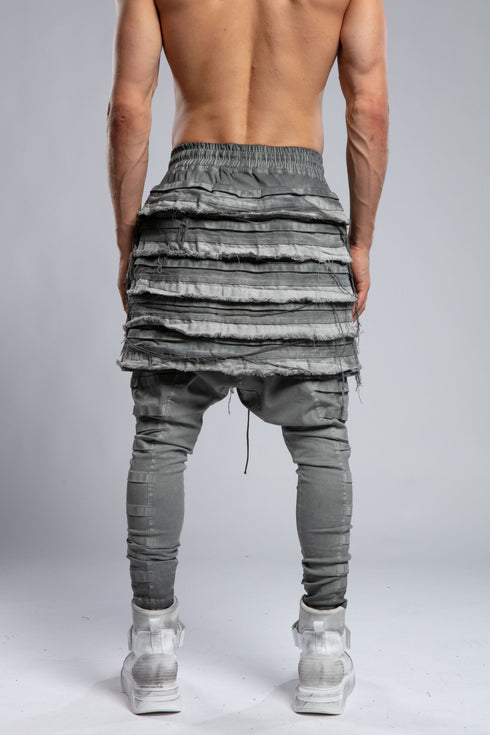 Junus Coban Men's Ribbed Raw Seam Pants in Grey back view with layered raw seam panel design