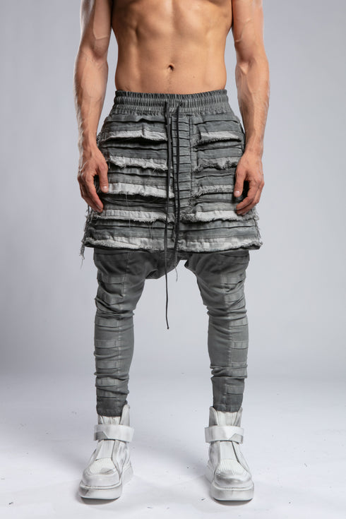 Junus Coban Men's Ribbed Raw Seam Pants in Grey close front view showing layered ribbed raw seam construction