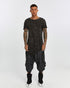 Men's Raw Seam T-shirt in Acid Black front view with pointed hem and exposed seam detail