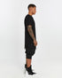 Men's Raw Seam T-shirt in Black profile view with pointed front hem