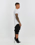Men's Raw Seam T-shirt in White profile view with pointed front hem