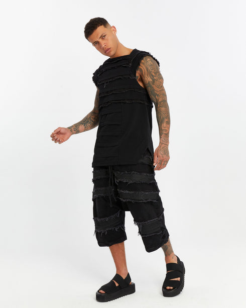 Men's Short Sleeve T-shirt in Stone Black angled detail view showing layered raw-edge finish